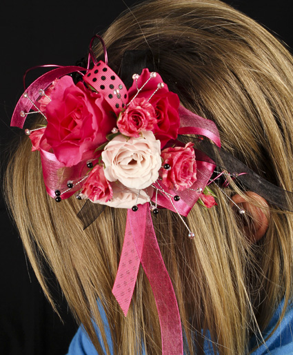 This fun pink head band features various colors of pink flowers with polka dot ribbon and beaded accents.